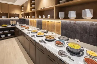 a kitchen with many plates of food on a counter at Hyatt Place Reno in Reno