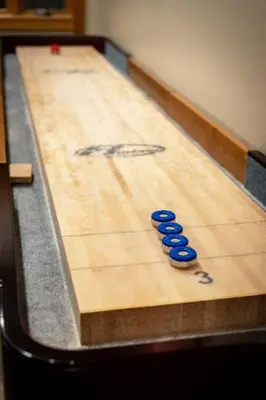a bowling alley with blue pins on the lanes at On Tahoe Time - Pets Pool Table Game Room in South Lake Tahoe