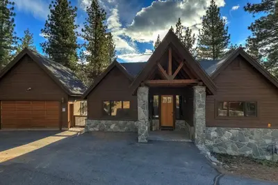 a house with a garage in front of it at On Tahoe Time - Pets Pool Table Game Room in South Lake Tahoe