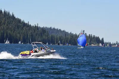 a group of people in a small boat on a lake at Windwood Inn in Shaver Lake