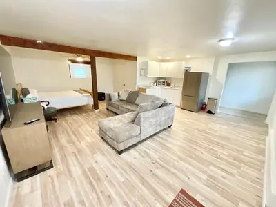 a living room with a couch and a kitchen at Spacious sequoia Park retreat, best panoramic views in Three Rivers