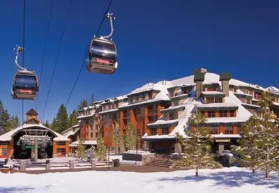 a ski lodge with a ski lift in the snow at Marriott Timber Lodge 2BD Villa in Stateline