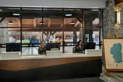 two women sitting at a counter in a restaurant at Marriott Timber Lodge 2BD Villa in Stateline