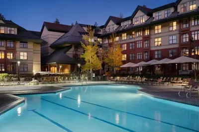 a large swimming pool in front of a hotel at Marriott Timber Lodge Luxury Studio in Stateline