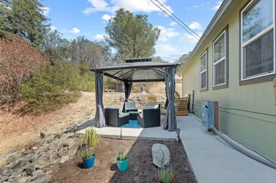 a gazebo on the side of a house at Minutes from Sequoia Entrance in Three Rivers