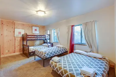a bedroom with two beds and a window at Game Rooms, Sauna and Decks South Lake Tahoe Home in South Lake Tahoe