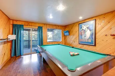 a pool table in a room with wooden walls at Game Rooms, Sauna and Decks South Lake Tahoe Home in South Lake Tahoe