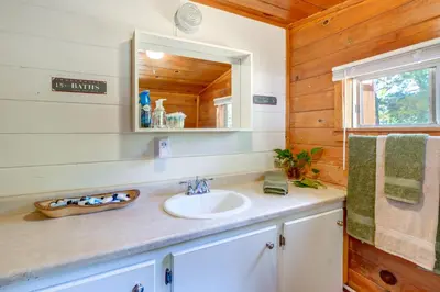 a bathroom with a sink and a mirror at Rustic Cabin with Patio 8 Mi to Kings Canyon Park in Miramonte