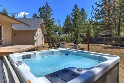 a hot tub in the backyard of a house at Adventure Awaits - Pets - Hot tub - Fire pit in Mevers