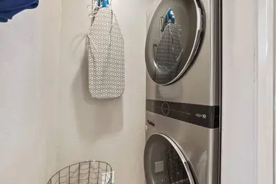 a washer and dryer hanging on a wall at Adventure Awaits - Pets - Hot tub - Fire pit in Mevers