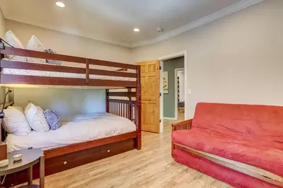 a bedroom with two bunk beds and a couch at Elegant 6 Bed Sleeps 14 - Best for families w kids in South Lake Tahoe