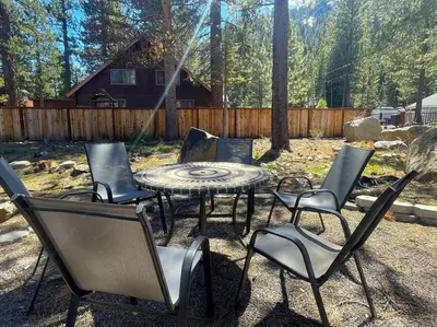 a group of chairs and a table in a yard at Panorama Chalet - Hot tub - Pool Table - Snow in Nebelhorn