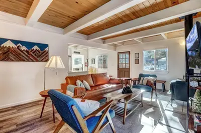a living room with a couch and a table at Panorama Chalet - Hot tub - Pool Table - Snow in Nebelhorn