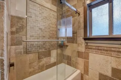 a bathroom with a glass shower with a tub at Chateau de Navahoe - Luxury - Hot tub - Large yard in South Lake Tahoe