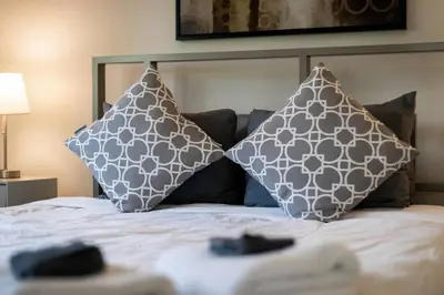 a bed with two pillows on top of it at Sierra Solace - Forest & Seasonal River Out Back in South Lake Tahoe