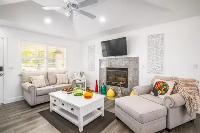 a living room with a couch and a fireplace at Remodeled 1 Acre Ranch Home in Madera in Madera