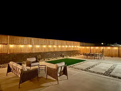 a patio with a table and chairs and lights at Spacious new house in Folsom Ranch 4BD and 3BA with backyard and BBQ grill in Folsom