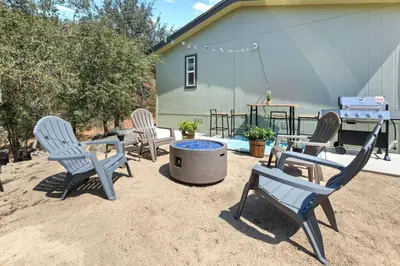 a group of chairs sitting around a fire pit at 10 Min Drive to the Sequoias in Three Rivers
