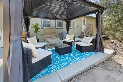 a patio with a gazebo with chairs and tables at 10 Min Drive to the Sequoias in Three Rivers