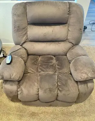 a brown leather reclining chair with a computer mouse on it at Waterfront Home w 40x16 Berth in Bethel Island