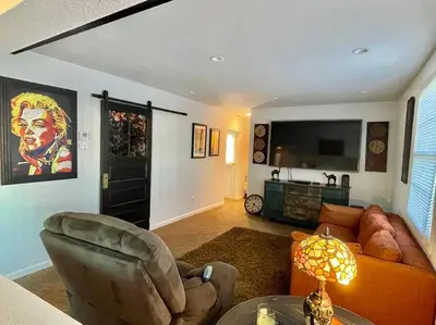 a living room with a couch and a television at Waterfront Home w 40x16 Berth in Bethel Island