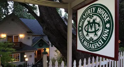a sign for a harry hoover mansion in front of a house at McCaffrey House Bed and Breakfast Inn in Twain Harte