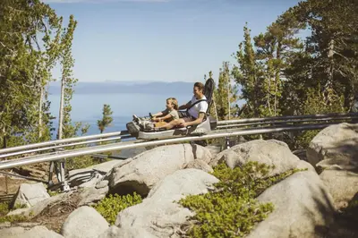a woman and child on a roller coaster at a zoo at Luxury 4BDR Residence steps from Heavenly Village condo in South Lake Tahoe