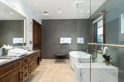 a bathroom with a tub and a sink and a toilet at Luxury 4BDR Residence steps from Heavenly Village condo in South Lake Tahoe