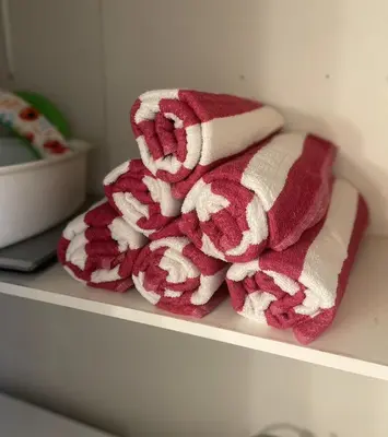 a pile of towels sitting on a shelf at Hot tub - Play structure - Mini pool table game in South Lake Tahoe