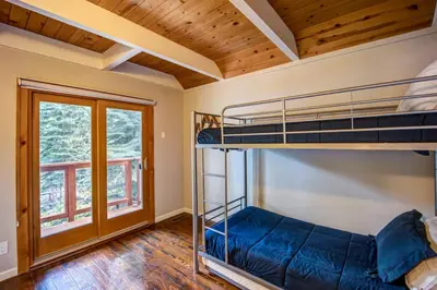 a bedroom with bunk beds in a house at Hot tub - Play structure - Mini pool table game in South Lake Tahoe