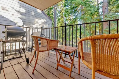 a screened in porch with two chairs and a grill at Carnelian Bay 2BR + Loft Near Beach & Trails in Carnelian Bay