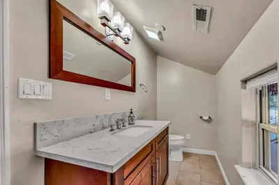 a bathroom with a sink and a mirror at Charming Tahoe Cabin with Private Beach Access in Tahoe City