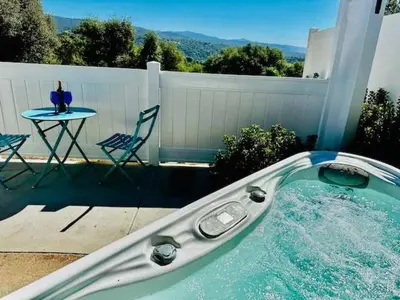 a swimming pool with a table and a table and chairs at Creature Comforts Suite-Private Hot Tub-Sleeps 2 in Ahwahnee