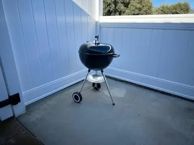 a charcoal grill sitting in front of a garage at Creature Comforts Suite-Private Hot Tub-Sleeps 2 in Ahwahnee