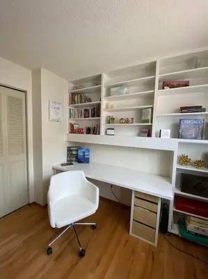 a office with a white desk and a white chair at Redwood Garden in Sacramento