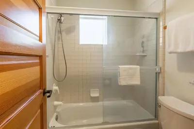 a bathroom with a shower and a tub with a glass door at Snowcreek #793 Phase V - 3 Bedroom 3 Bath Sleeps 8 with Private 1 Car Garage in Mammoth Lakes