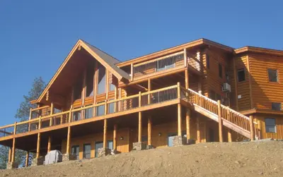 a large wooden house on top of a hill at Courtwood Inn in Murphys