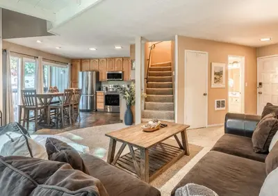 a living room with a couch and a table at Sierra Park Villas #76, Updated 1 Bedroom + 2 Lofts, 2 Bath, Sleeps 6! in Mammoth Lakes