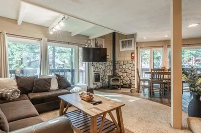 a living room with a couch and a table at Sierra Park Villas #76, Updated 1 Bedroom + 2 Lofts, 2 Bath, Sleeps 6! in Mammoth Lakes