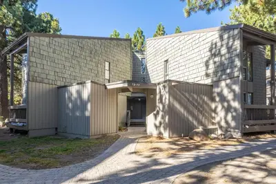a house with two buildings with a driveway at Sierra Park Villas #76, Updated 1 Bedroom + 2 Lofts, 2 Bath, Sleeps 6! in Mammoth Lakes