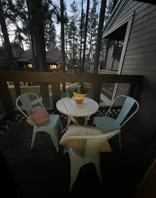 a patio with a table and chairs on a porch at The Pad at South Lake Tahoe in Bijou Park