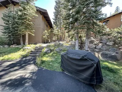 a tent sitting in the grass next to a building at Mammoth Point #117 condo in Mammoth Lakes