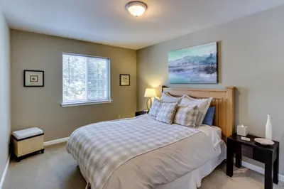 a bedroom with a large bed and a window at The Gathering Place in Truckee