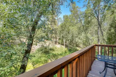 a deck with a bench and a table on it at Mtn-View Gem Deck, Grill and Fire Pit in West Point in Volcano