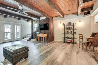a living room with a ceiling fan and a tv at Mtn-View Gem Deck, Grill and Fire Pit in West Point in Volcano