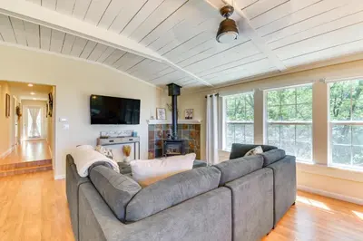 a living room with a couch and a tv at Sonora Hilltop Home Scenic Views, Pet Friendly! in Sonora
