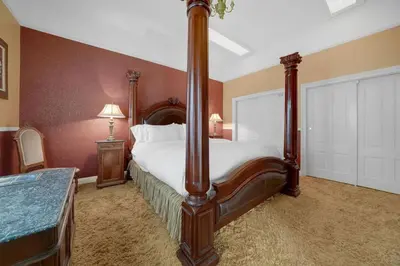 a bedroom with a large bed in a room at Romantic Victorian Getaway The Hideaway in Sutter Creek