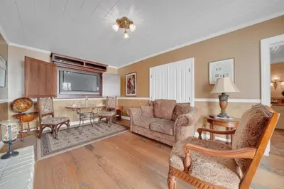a living room with a couch and a table at Romantic Victorian Getaway The Hideaway in Sutter Creek