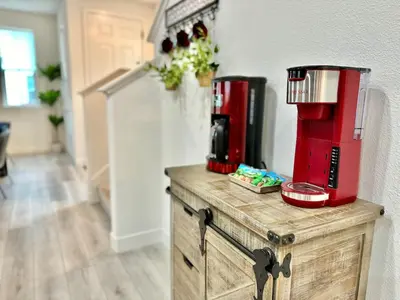 a counter with a coffee maker on top of it at Charming and Modern 3-Bedroom Home in Rocklin in Rocklin