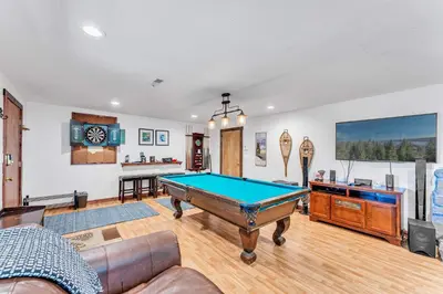 a living room with a pool table in it at Updated Tahoe Retreat Near Trails with Game Room in Kings Beach